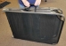 Folded cot includes carry handle